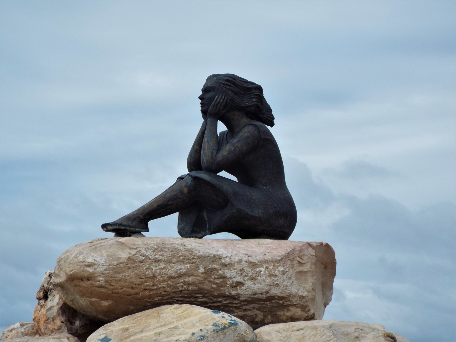 Sculpture on Malecon of woman waiting for her husband\u0027s return from the sea
